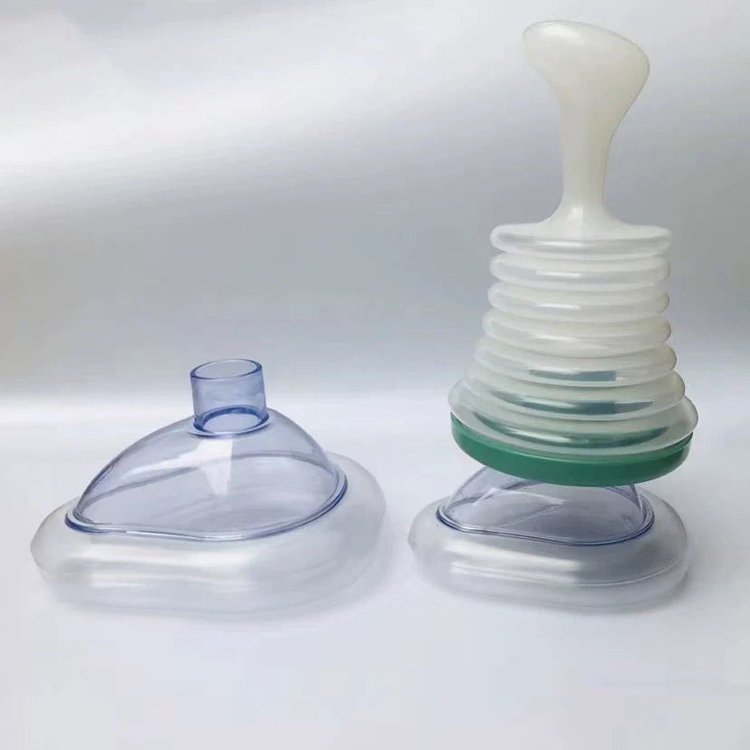 Airway Clearing Device with Manual Suction and Universal Mask Fit