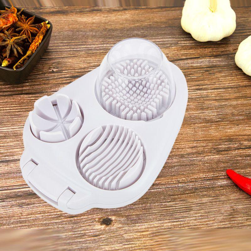 Premium white kitchen garlic press and slicer tool on wooden table, clarioy homeware product